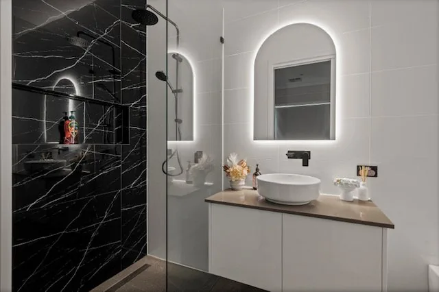 Bespoke bathrooms, Adelaide: vanity run looking through to a black marble shower
