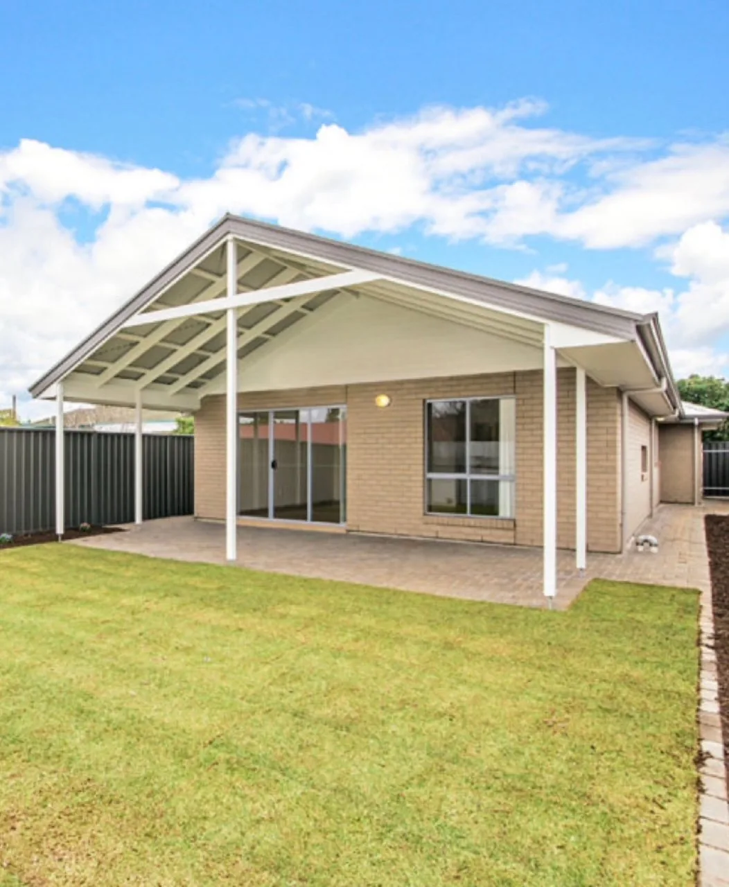 Rear alfresco and lawn of a completed new home