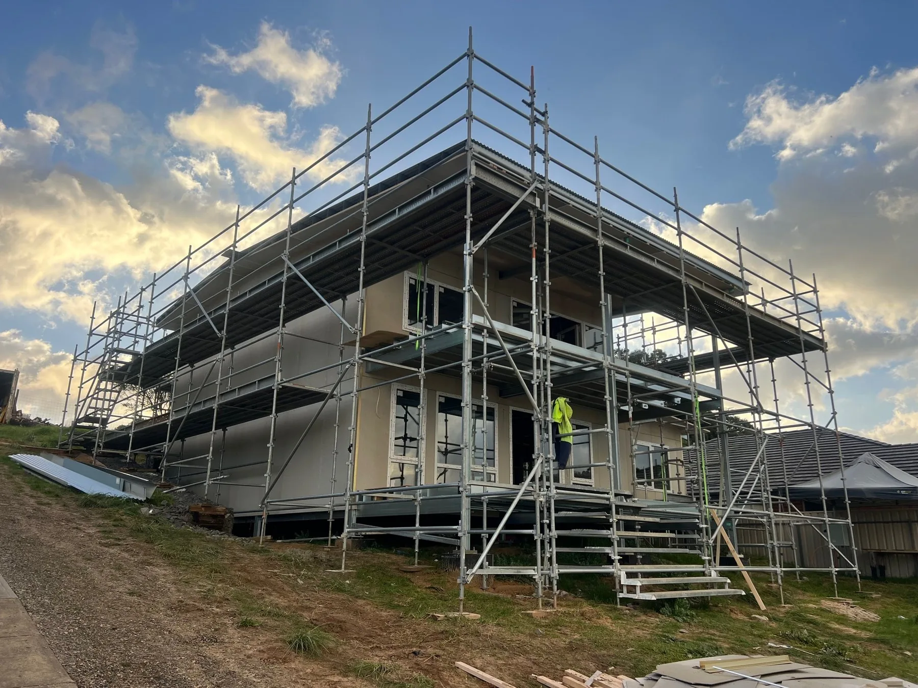 New builds, South Australia: two storey home standing in scaffold at sunset