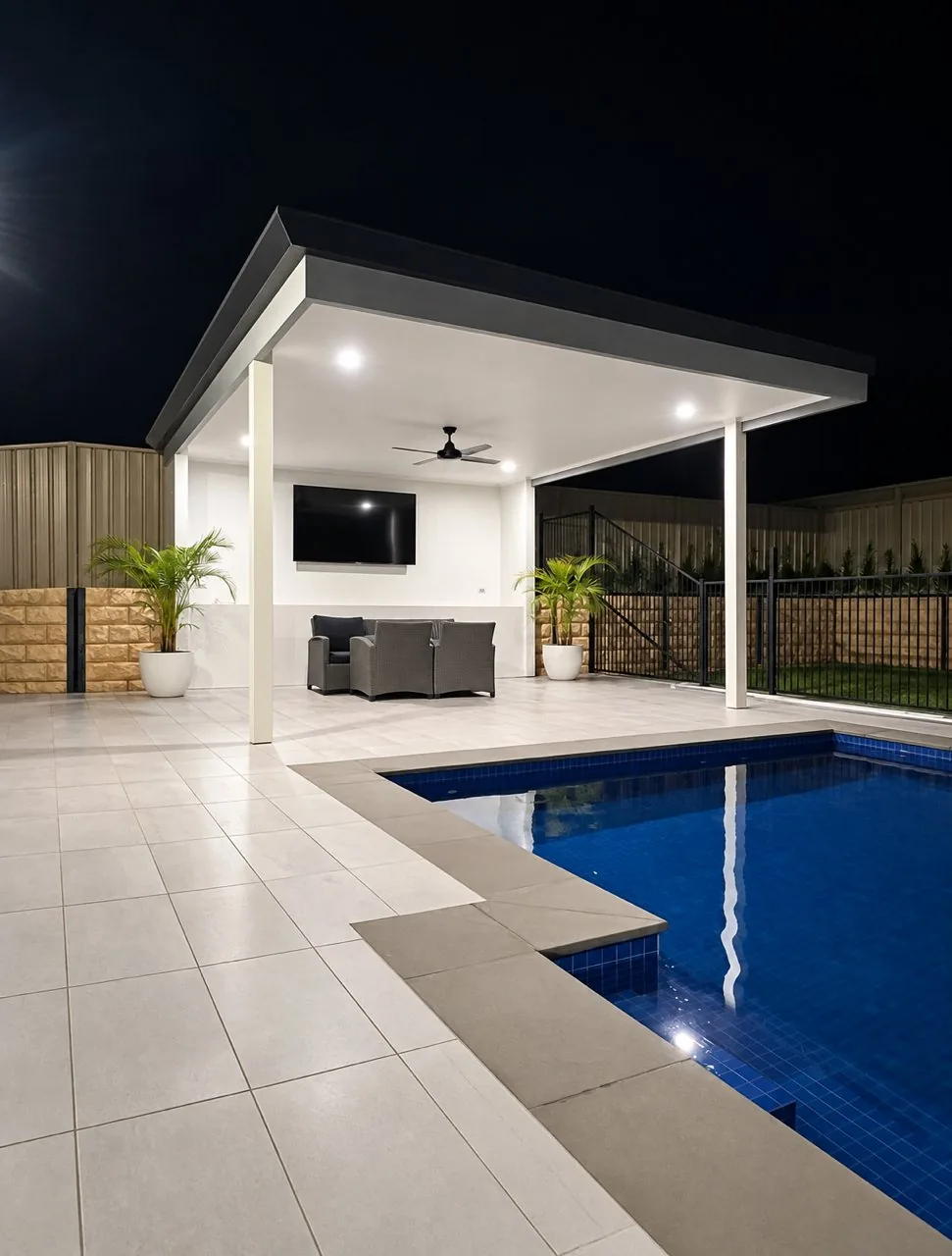 Outdoor living build in Adelaide, covered pavilion and pool lit at night