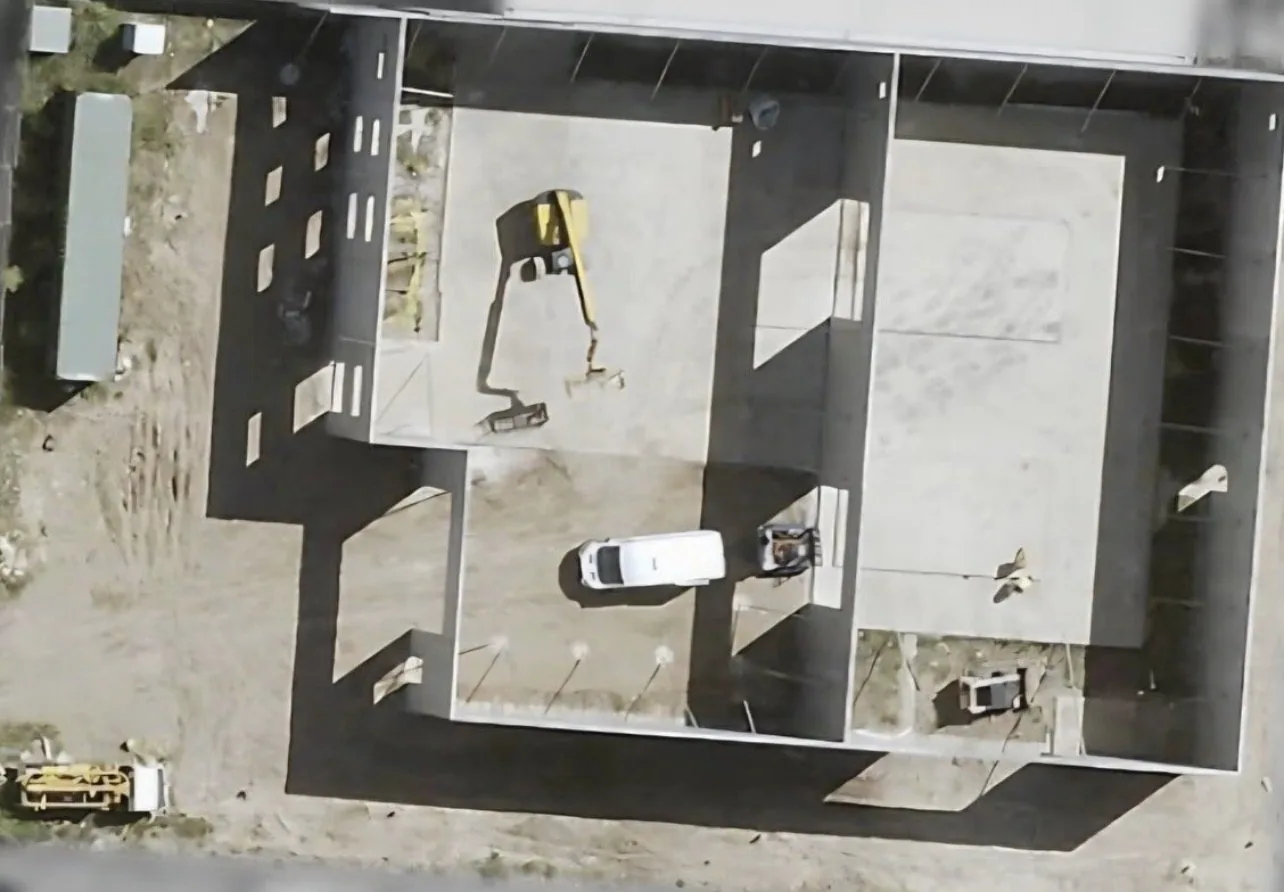Aerial view of a slab and footings set out before fit out