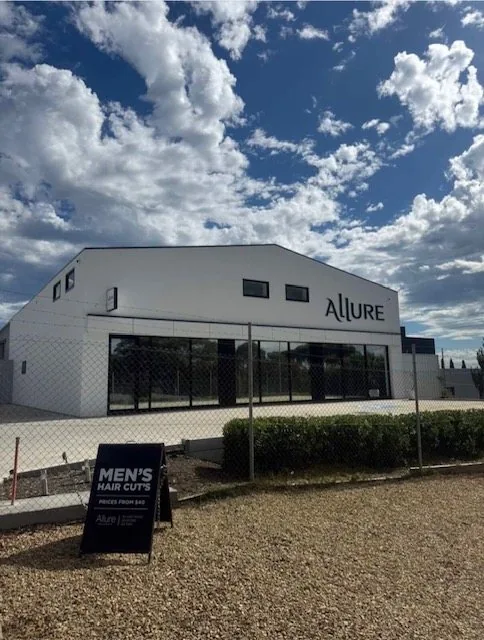 Completed commercial building exterior with glazing and signage